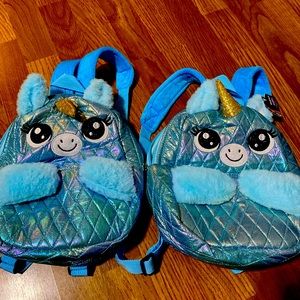 2 matching unicorn backpacks